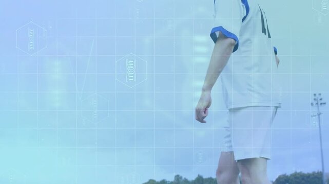 Male soccer player walking pitch, shifting gaze leading to extending arm HUD tracking pass intent