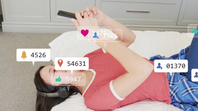 Teenage girl in bed tapping phone, starting animated badges for social media stacking across screen
