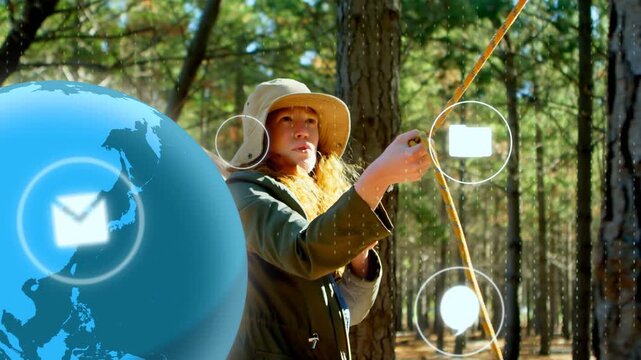 Camper finding slack pulling yellow rope to tree, tech globe and icons floating around guiding camp