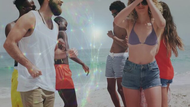 Group of friends dancing on sand music starting and lens flares highlighting shades for marketing
