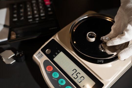Jewelry evaluation includes weighing to verify value and support pricing decisions.