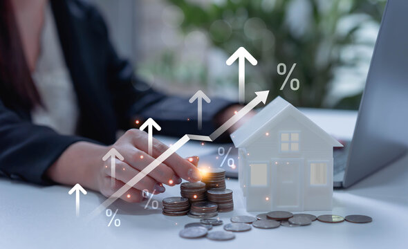 Businesswoman reviewing percentage interest rate for real estate, mortgage and loan planning, financial investment analysis, housing finance and money management concept.