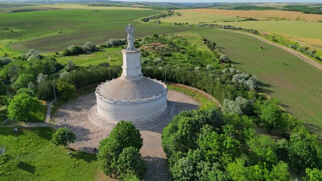 Cinematic aerial drone shot of the Tropaeum Traiani victory monument built by Emperor Trajan. Ancient Roman architecture in Dobrogea region, Adamclisi, Romania.