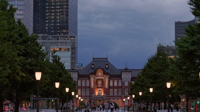 Twilight in Tokyo  :  As Lights Glow in the Historic Landmark Amidst Towering Skyscrapers, the Urban Center Pulses With the Rush Home  |  Tokyo Station, Tokyo, Japan