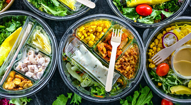 Plastic boxes with pre-packaged vegetable salads