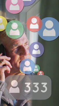 Vertical video: Man phone at ear connecting avatars drifting over face and counter rising 999 ads