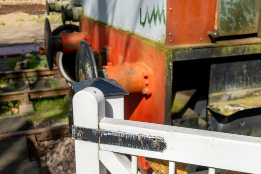 Close and selective focus on a white gate post in a shunting yard. Intentional bokeh