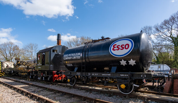 Whitwell, Norfolk, UK - April 12 2026. A disused and vintage Esso Fuels oil tanker in the shunting yard of a rural train station