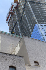 Fototapeta premium historic brick building (rear of Royal Alexandra Theatre, located at 260 King St W, and FORMA condos slight view of 