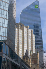 Fototapeta premium Symphony Place (71 Simcoe St) between office towers and St. Andrew's Presbyterian Church, Toronto