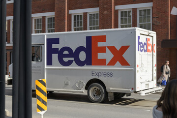 Naklejka premium FedEx Express delivery truck heading east on Adelaide St W, Toronto