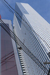 Fototapeta premium exterior of 19 Duncan, designed by Hariri Pontarini Architects -- a mixed-use integration of the heritage Southam Press Building and a modern 58-storey tower, housing Thomson Reuters offices