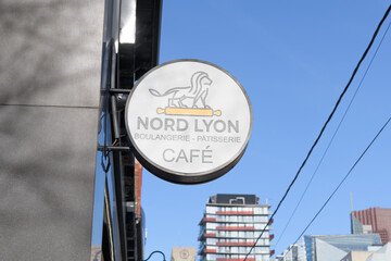 Fototapeta premium sign outside Nord Lyon, a bakery, located at 250 Queen St W, Toronto