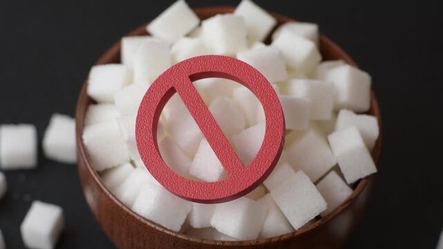 The sugar ban sign as a concept to stop the problem of diabetes and obesity, a call to diet. The sugar ban sign as a background for your design