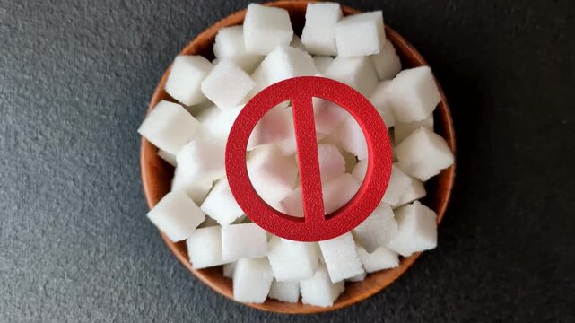 The sugar ban sign as a concept to stop the problem of diabetes and obesity, a call to diet. The sugar ban sign as a background for your design