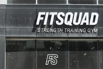 Naklejka premium sign on the exterior of Fit Squad Training Gym located at 111 Peter St, Toronto