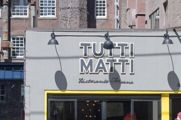 Naklejka premium exterior facade and sign of Tutti Matti, a Tuscan restaurant, located at 364 Adelaide St W, Toronto