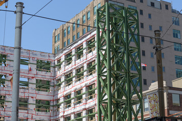 Obraz premium facade retention system (of a property at 355 Adelaide St W) with weatherproofing membrane, Queen Spadina station complex, Ontario Line, Toronto