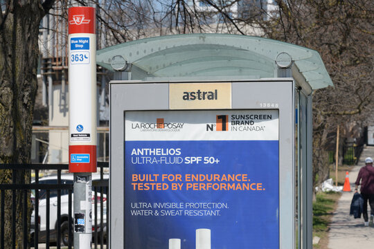 bus stop and shelter on Strachan Av, feat out of home advertising for sunscreen, Toronto