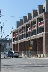 Fototapeta premium perspective view of Junction SQ, a low-rise residential block, by Block Developments, designed by RAW Architects, located at 410 Keele St, The Junction, Toronto