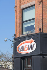 Obraz premium exterior building and sign of A&W Canada, a hamburger restaurant chain, located here at 2858 Dundas St W (northwest corner) in historic Campbell Block, The Junction, Toronto
