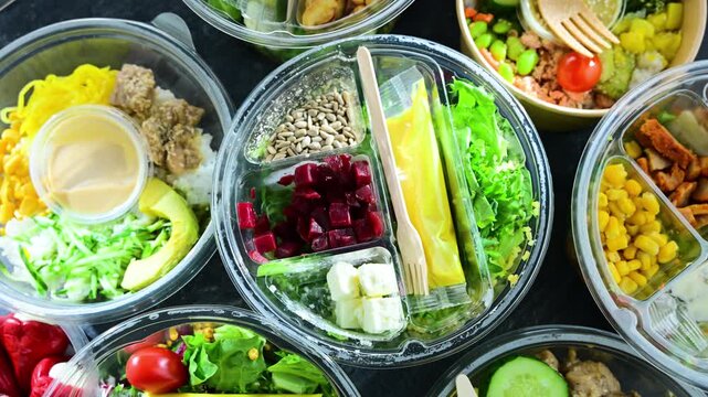 Plastic boxes with pre-packaged vegetable salads. Convenience food