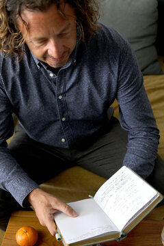 Man Reading Journal