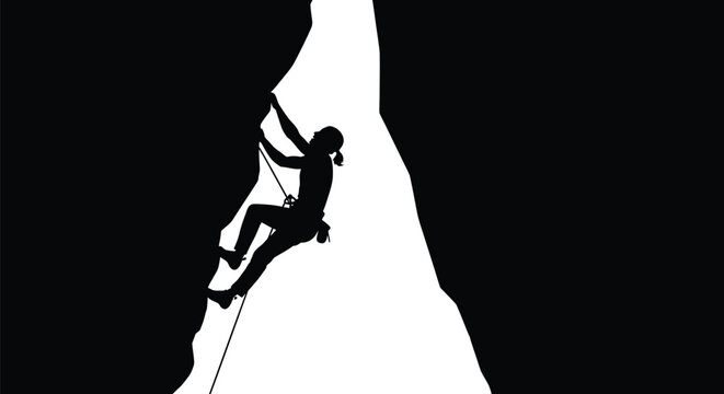 Silhouette of a determined female rock climber ascending a challenging mountain face using safety rope.
