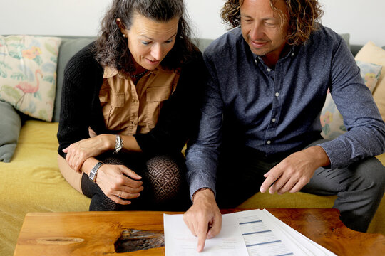 Couple Reviewing Documents Together