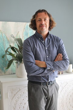 Man With Arms Crossed Indoors