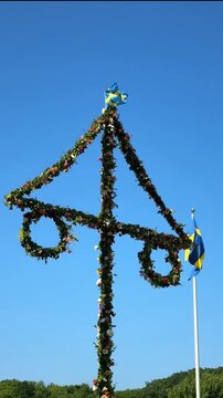 Midsummer festival in Sweden.Dancing around a pole celebrating middle of summer