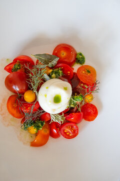 Close up of tomato salad with dressing - vertical