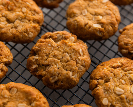 close up of an ANZAC biscuit on a cooling rack