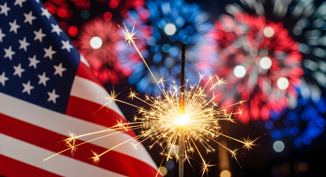 Sparkler burning with american flag and fireworks in the background, celebrating independence day or fourth of july