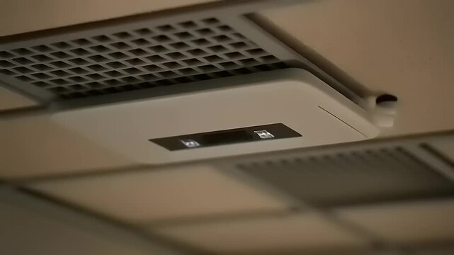 Close-up of ceiling air vent system.