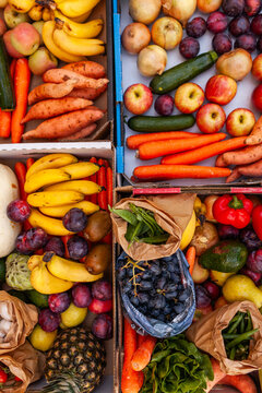 Colourful overhead angle of fresh organic fruit and vegetable boxes at unsupermarket food hub