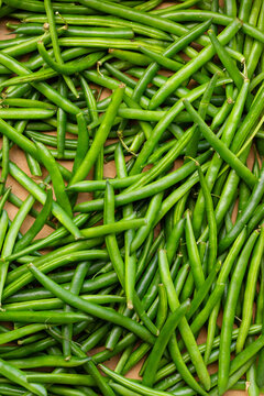 Fresh organic green beans filling box