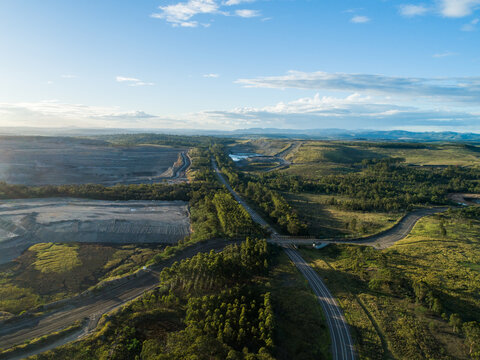 Landscape in hunter valley with open cut coal mine pit on horizon