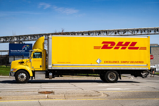 View of DHL delivery truck near Toronto Pearson International Airport. Toronto, Canada - April 23, 2026.