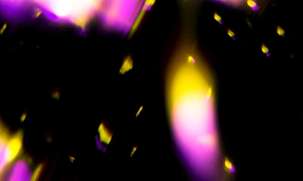Abstract light effect featuring vibrant pink and yellow flares creating a dynamic visual composition with motion blur and glowing energy patterns