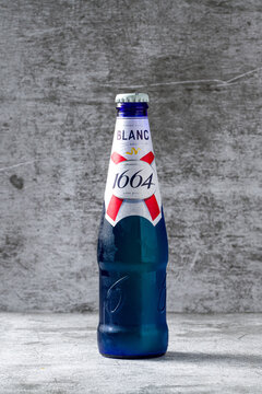 Antalya, Turkey - April 25, 2026: 1664 Blanc beer bottle with blue glass on concrete background