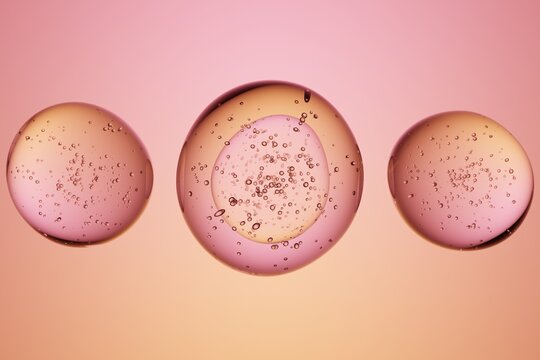 Transparent bubbles with air inclusions, pink orange gradient background