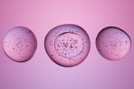 Transparent spheres with bubbles on pink background