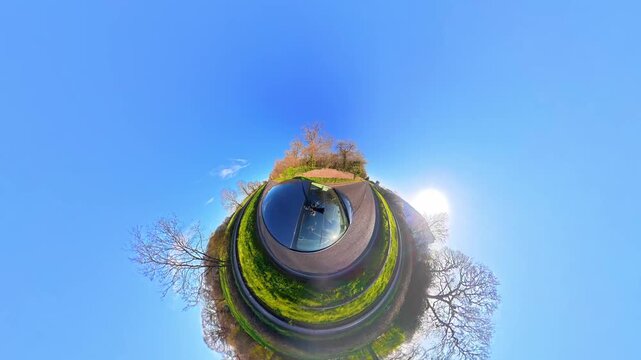 Ultra Wide Footage of British Urban City Streets During Car Drive. The Footage Was Captured with Car Roof Mounted 360 Camera During Sunny Day