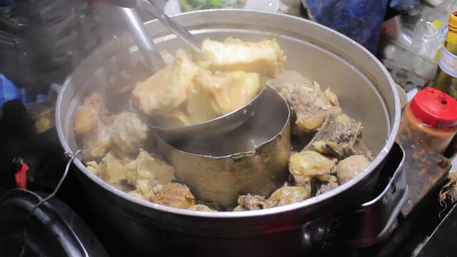 Beef Meatballs Being Taken from Steaming Pot Street Food Close Up