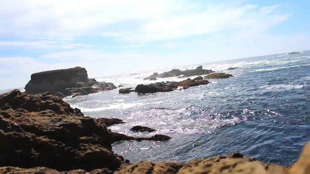 Calm Ocean Over Flat Coastal Rocks at Evening &ndash; Gentle Waves Flowing Across Rocky Shoreline, Warm Sunset Light, Peaceful Seaside Landscape, Natural Beach Scene 4K Footage