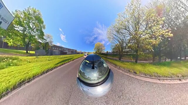 Ultra Wide Footage of British Urban City Streets During Car Drive. The Footage Was Captured with Car Roof Mounted 360 Camera During Sunny Day