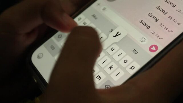 Typing Message Sayang on Smartphone Chat App Close Up