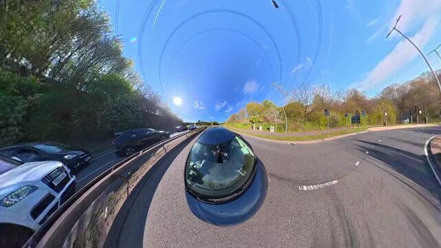 Ultra Wide Footage of British Urban City Streets During Car Drive. The Footage Was Captured with Car Roof Mounted 360 Camera During Sunny Day