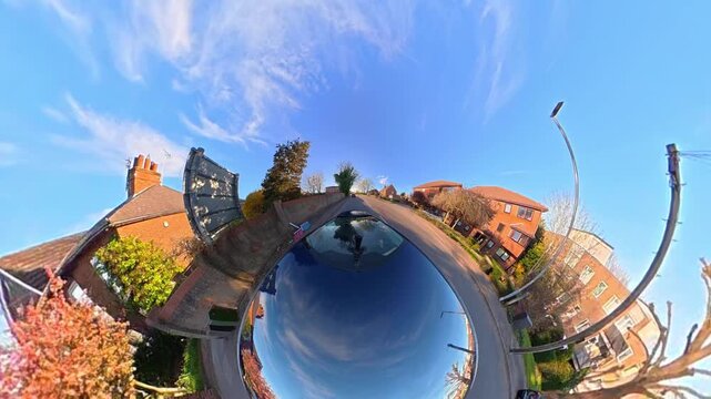 Ultra Wide Footage of British Urban City Streets During Car Drive. The Footage Was Captured with Car Roof Mounted 360 Camera During Sunny Day